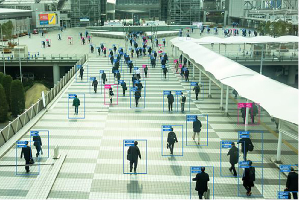 Wireless Guardian threat detection intelligence signals on stadium with many people walking